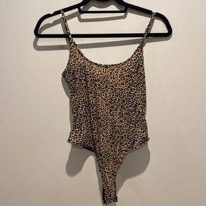 Cheetah print body suit. Size small. Never worn.